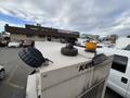 A 2005 Katolight SED60FPJ4 generator with a rusty exhaust pipe and a yellow warning light on its roof