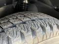 Close-up view of a tire tread on a 2016 Mercedes-Benz Sprinter showing detailed patterns and grooves designed for traction