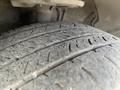 Close-up of a worn tire from a 2018 Toyota Highlander showing tread patterns and wear signs