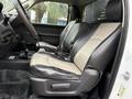 Interior of a 2012 Dodge Ram 5500 featuring black and beige leather seats with a console and visible controls