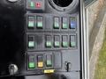A control panel featuring multiple black switches and buttons labeled for operating a 2004 Bombardier SW48 with various symbols denoting functions