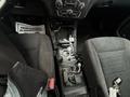 2017 Dodge Charger interior featuring black fabric seats a gear shift and various control buttons on the center console
