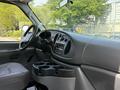 Interior view of a 2008 Ford Econoline showing the dashboard and cup holders with a focus on the steering wheel and controls