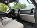 Interior of a 2019 Ford F-350 SD showing the driver's seat dashboard and console with controls and a touchscreen display