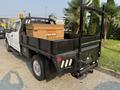 2021 Ford F-350 SD pickup truck with a flatbed and storage box on the back equipped with a safety light and rear step bumper