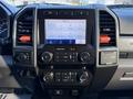 Dashboard of a 2020 Ford F-350 featuring a touch screen display with controls for audio and climate settings