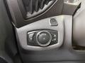 Control panel with buttons and a dial for adjusting lights in a 2017 Ford Transit Connect