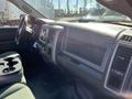Interior of a 2015 RAM 1500 showing the dashboard and center console with controls and cup holders