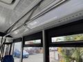 Interior view of a 2018 Grande West Vicinity bus showing overhead lighting and seating with blue patterned fabric