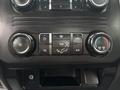 The dashboard control panel of a 2018 Ford F-550 featuring climate control buttons for temperature and air conditioning settings