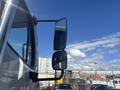 Close-up of the side mirror of a 2022 Freightliner M2 106 showing the dual mirrors angled for visibility