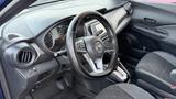 Interior view of a 2019 Nissan Kicks featuring a steering wheel dashboard and seats with a modern design