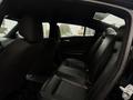Interior view of a 2017 Dodge Charger showing the back seats with black leather upholstery and ample legroom