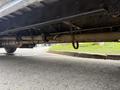 Underside view of a 2022 Freightliner B2 showing the chassis suspension system and axle components
