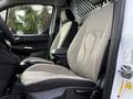 A 2017 Ford Transit Connect featuring gray fabric seats with a modern design and a spacious front cabin layout