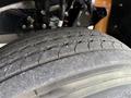 Close-up of a worn tire tread from a 2022 Lion Lion6 showcasing distinct grooves and patterns on the rubber surface