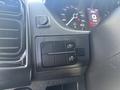 Close-up of the dashboard controls of a 2022 RAM Promaster 350 featuring buttons for lights and other vehicle functions