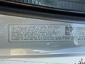 A 2011 Freightliner M2 106 vehicle identification label displaying safety standards and manufacturing information