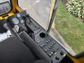 The cockpit of a 2004 Bombardier SW48 featuring a control panel with gauges levers and buttons in various colors