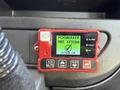 A red control panel displaying the Fogmaker fire system with indicators for alarm fault and system status showing OK