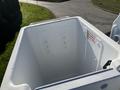 Top view of a white freightliner truck bed with smooth walls and no visible cargo inside