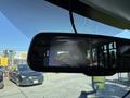 2020 Chevrolet Express displaying a rearview camera feed on the mirror screen with guiding lines for parking assistance