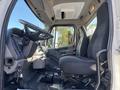 Interior view of a 2005 Freightliner M2 106 featuring a driver's seat steering wheel and dashboard controls