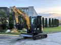 A 2023 Sany SY35U mini excavator with a black and yellow body features an extended boom and a metal bucket attached at the front