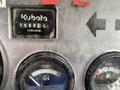 Close-up of the dashboard of a 2010 Kubota RTV 900 showing hour meter and gauges for temperature and fuel levels