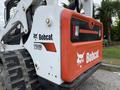 A 2017 Bobcat T740 compact track loader with a prominent orange and black Bobcat logo and model number 7740 on the rear panel