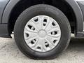 Close-up of a 2017 Ford Transit wheel showing a silver hubcap with a multi-spoke design and a black tire with tread pattern