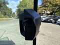 A black door handle on a 2021 John Deere 1575