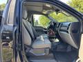 A 2022 Ford F-350 SD interior featuring gray fabric seats with a spacious cabin and a dashboard visible from the driver's side