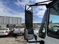A 2014 International TerraStar truck with a large side mirror prominently displayed in the foreground