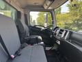 Interior view of a 2012 Hino 338 showing driver's seat steering wheel dashboard and passenger seat