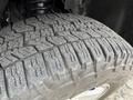 Close-up of a tire tread on a 2012 GMC Canyon showcasing detailed patterns and grooves designed for traction and stability