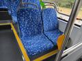 Two blue bus seats with a white star and dot pattern in a 2018 Grande West Vicinity bus interior