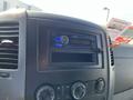 Interior dashboard of a 2010 Mercedes-Benz Sprinter featuring a car stereo and control knobs for temperature and air settings