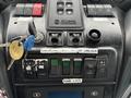 Control panel of a 2017 Autocar Xpert featuring various buttons switches and a key ignition system