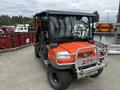 A 2011 Kubota RTV 1140 CPX utility vehicle with an orange and gray body and a front windshield designed for off-road transport and tasks