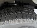 A close-up of a tire from a 2019 Chevrolet Express showing detailed tread patterns and textured rubber surface
