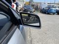 Side mirror of a 2004 BMW 6-Series showing the sleek design and modern contours of the vehicle