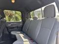 Interior view of a 2021 RAM 5500 showing the rear bench seat with gray upholstery and seatbelts