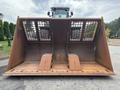 A 2012 Caterpillar 980 front-end loader with a large bucket featuring a grid at the top and two wide openings at the bottom