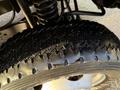 Close-up of a tire from a 2010 Ford F-550 showing a detailed tread pattern and visible wear on the rubber surface