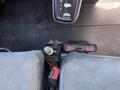 The interior view of a 2011 International 4300 showing the gear shifter and controls with two seats visible beside it