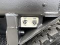 A control panel with two switches labeled Hopper Lift and Hopper Dump positioned on the side of a 2013 International DuraStar 4300 truck