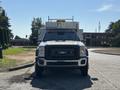 A 2011 Ford F-550 with a black front grille and prominent headlights facing forward