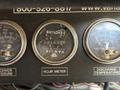 Close-up of the dashboard gauges from a 2008 Workhorse W62 including an hour meter with a reading of 0150 and gauges for receiver pressure and discharge temperature