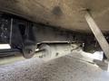 A 2017 Freightliner MT45 with visible undercarriage components including a drive shaft and exhaust system displayed from a low angle